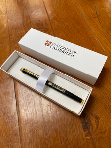 100 x  Engraved Black or Blue/Brass Rollerball Pen and 100 x White Branded Satin Cardboard Pen Presentation Box